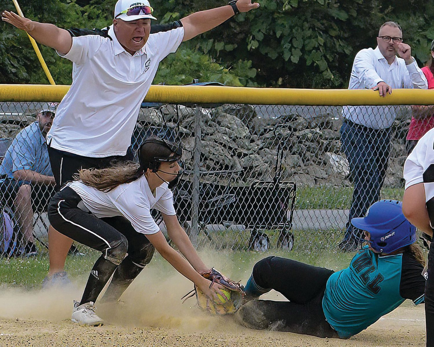 THE TAG: Aniyah Neves looks to tag a runner out at third.